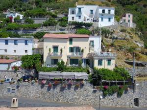 a house on top of a stone wall at Locanda Degli Agrumi in Conca dei Marini