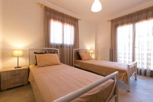 Ένα ή περισσότερα κρεβάτια σε δωμάτιο στο Velia Boutique Apartments
