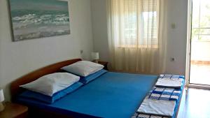 Postel nebo postele na pokoji v ubytování Apartments Krušvina
