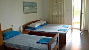Postel nebo postele na pokoji v ubytování Apartments Krušvina