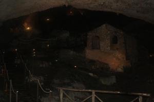 a cave with a church in the dark at B&B Don Domenico in Olevano sul Tusciano