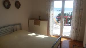 Postel nebo postele na pokoji v ubytování Apartman Viktor
