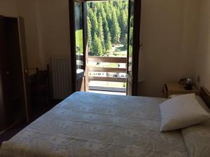 Postel nebo postele na pokoji v ubytování Hotel Meublè Adler - Rooms & Mountain Apartments