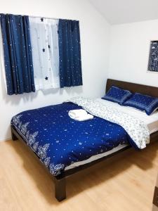 Postel nebo postele na pokoji v ubytování Tokyo Toneri Garden House-Stay
