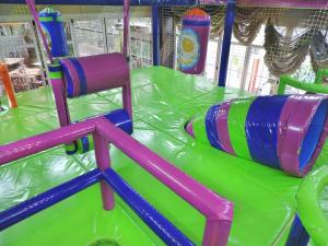 a water slide with a surfboard on a ride at Hotel Las Yucas in Atarfe