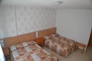 Łóżko lub łóżka w pokoju w obiekcie Hostal Casa Maria