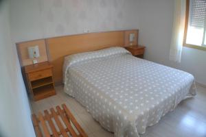 Łóżko lub łóżka w pokoju w obiekcie Hostal Casa Maria