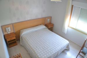 Łóżko lub łóżka w pokoju w obiekcie Hostal Casa Maria
