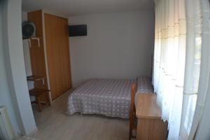 Łóżko lub łóżka w pokoju w obiekcie Hostal Casa Maria