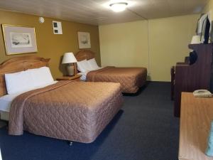 Ліжко або ліжка в номері Rodeway Inn
