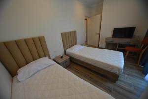 Postel nebo postele na pokoji v ubytování Hotel Elesio