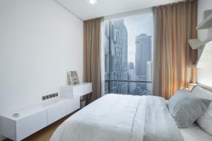 En eller flere senge i et værelse på Soho Suites KLCC by 21 Century travel