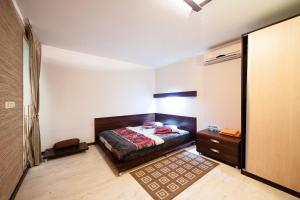 Ένα ή περισσότερα κρεβάτια σε δωμάτιο στο Квартира на Дерибасовской +1 φωτογραφίες