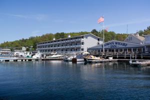 a marina with boats in the water and a building at Browns Wharf Inn in Boothbay Harbor