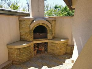 an outdoor fireplace is shown on a patio at Raduga 514 in Zatoka