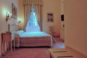 A bed or beds in a room at Chiaro Di Luna viale Italia