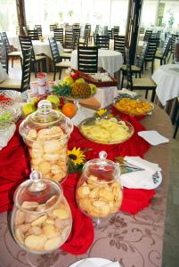 a table with many plates of food on it at Torre Del Sole in Terracina