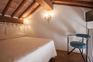 Säng eller sängar i ett rum på A Casa Mastacchi