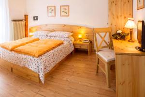 Postel nebo postele na pokoji v ubytování Il Cavallino - Albergo & Appartamenti