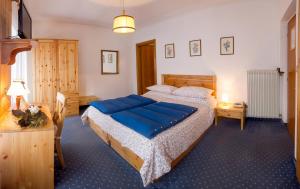 Postel nebo postele na pokoji v ubytování Il Cavallino - Albergo & Appartamenti
