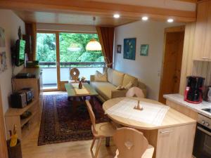 a living room with a couch and a table at Apartment Anna in Bad Gastein