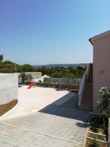 a building with a staircase and a stair case at Apartments T&C in Drage