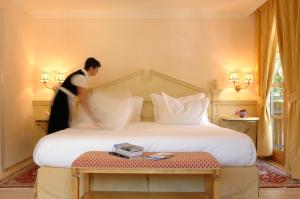 Ένα ή περισσότερα κρεβάτια σε δωμάτιο στο Alpen Suite Hotel