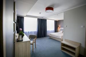 Postel nebo postele na pokoji v ubytování Elba Hotel