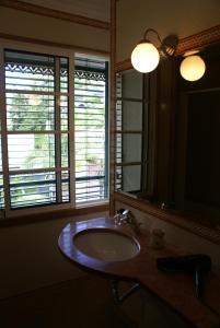 a bathroom with a sink and a mirror at Loft Paços da Vila in Ribeira Brava +32 photos
