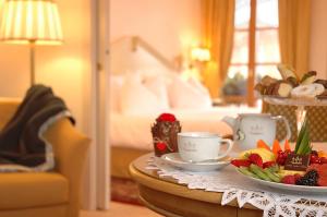Ένα ή περισσότερα κρεβάτια σε δωμάτιο στο Alpen Suite Hotel
