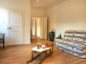 a room with a table and a stack of mattresses at La Clé d'Alsace in Sainte-Marie-aux-Mines