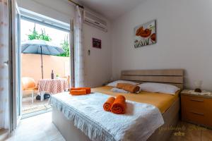 Posteľ alebo postele v izbe v ubytovaní Apartments Nives Suhi Potok