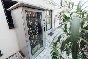 a vending machine with drinks inside of a building at Heilbronner Pension am schönen Theater in Heilbronn
