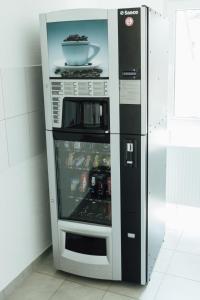 a black and silver refrigerator with a bowl in it at Heilbronner Pension am schönen Theater in Heilbronn