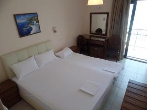 Postel nebo postele na pokoji v ubytování Plage Hotel