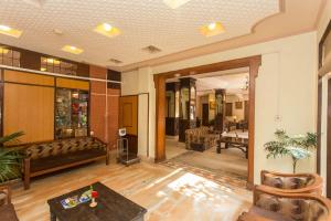 a living room with a couch and a table at Hotel Marshyangdi in Kathmandu