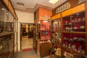 a room with many glass shelves with items on them at Hotel Marshyangdi in Kathmandu