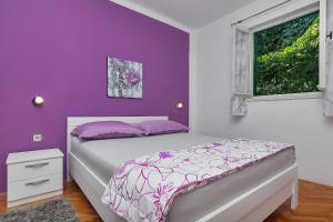 Кровать или кровати в номере Apartments Smiljka