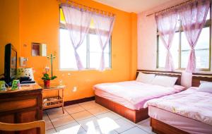 Katil atau katil-katil dalam bilik di You Ye De Lin B&B