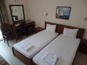 Postel nebo postele na pokoji v ubytování Plage Hotel
