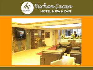 a lobby of a hotel and spa with couches and a television at BC Burhan Cacan Hotel & Spa & Cafe in Istanbul