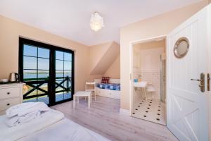 Posteľ alebo postele v izbe v ubytovaní Stare Sady Chillout Rooms "Pod Jabłoniami"