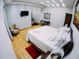 Ένα ή περισσότερα κρεβάτια σε δωμάτιο στο Master Hotel