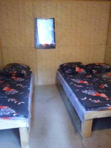 Tempat tidur dalam kamar di Turbaza Kedroviy bereg