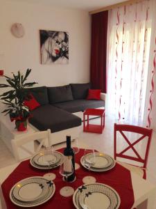 a living room with a couch and a table at Villa Jasmin in Bol