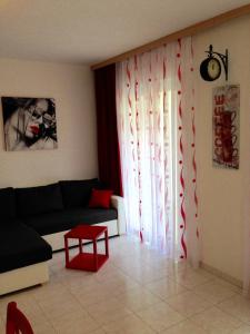 a living room with a couch and a window at Villa Jasmin in Bol