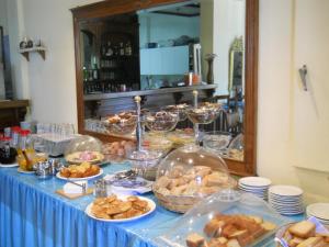a buffet of food on a blue table at Maistrali in Galissas