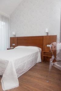 Ein Bett oder Betten in einem Zimmer der Unterkunft Hotel Alén do Mar