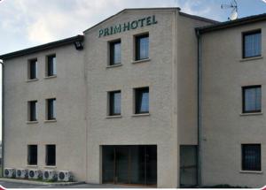 a building with the words palm hotel on it at Prim Hotel Reims in Witry-lès-Reims