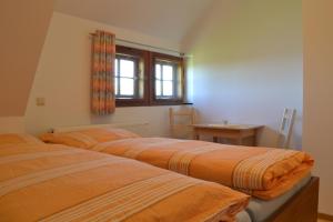 
Ein Bett oder Betten in einem Zimmer der Unterkunft Klügelhütte
